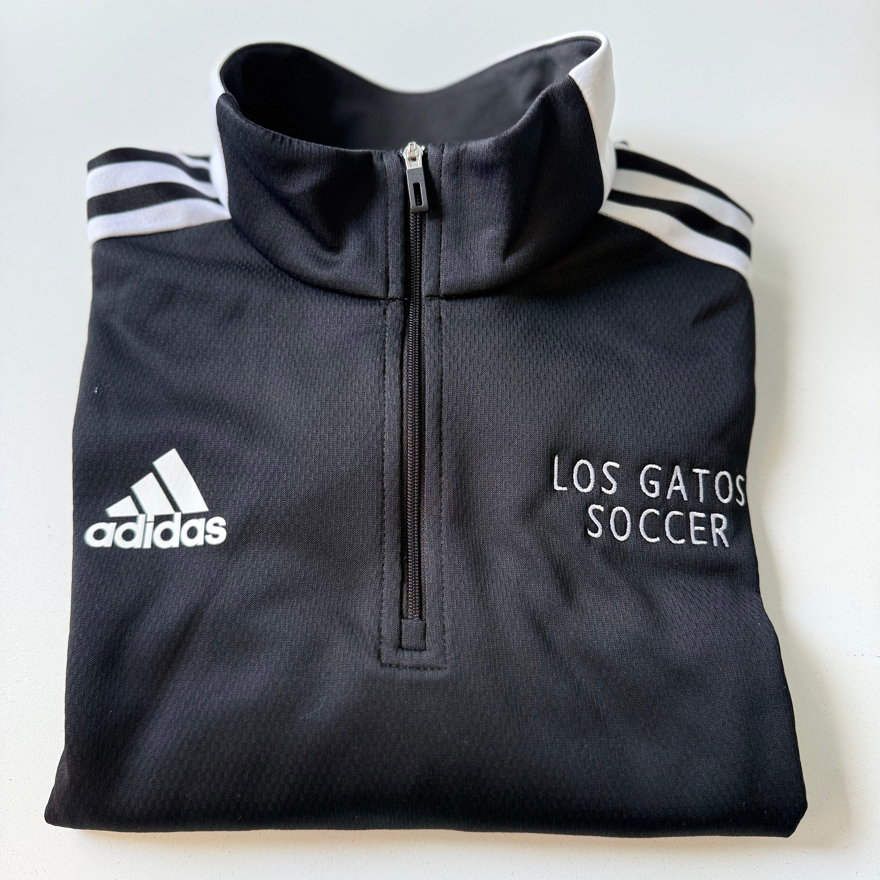 Gray Adidas quarter-zip sweatshirt with 'Los Gatos Soccer' text on a white background